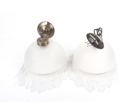 A pair of vintage etched glass lamp shades. Of domed form, the frosted shades decorated with scrolling details, the rims supp