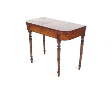 A George IV mahogany card table. With red baize interior and two hinged rear ring turned legs and rosewood cross banding, 71 
