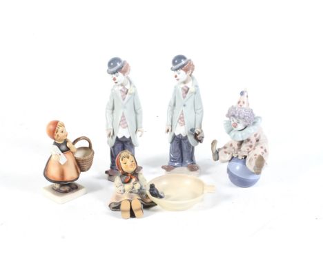 Two West German Goebel Hummel figures and three Lladro clowns. The first of a girl holding a letter, numbered 13/0, and a gir