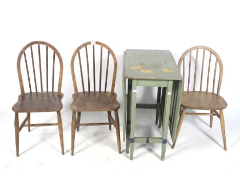 A green painted gateleg dining table and three dining chairs. Table decorated with ducks, chickens and chicks together with t