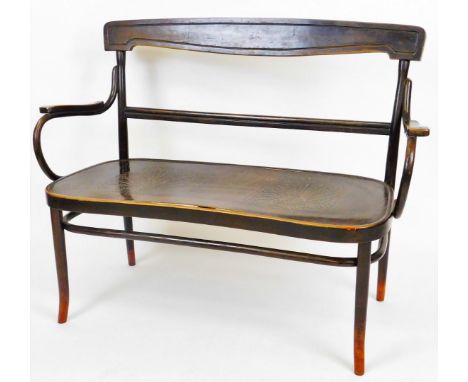 A mid 20thC Czechoslovakian beech stained bench settle, with horizontal cresting rail and splat with bent wood arms on cylind