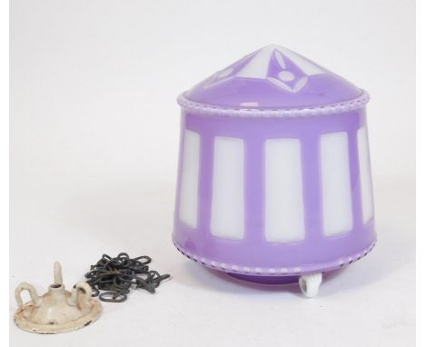 A 20thC glass light shade, in purple and milk glass, with domed top, cylindrical body and shaped scroll feet, 24cm H, with me