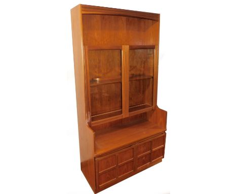 A Nathan style teak cabinet, with open shelf raised above two glazed doors with double cupboard beneath, unmarked, 199cm H, 1