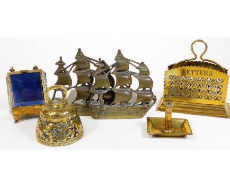 Various metalware, a small metal bell, 9cm H, a glazed ring casket on shaped feet, miniature candlestick, ship bookends and a