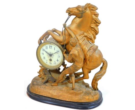 A 19thC spelter and gilt metal mantel clock, set with rearing horse and figure to his side, on a rock work base, with 10cm Di