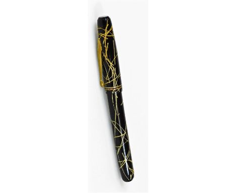 A Wearever fountain pen, in gilt and black trim with double banding and named arrow clip, named 14k white metal nib, 13cm W. 