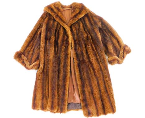 A ladies three quarter length fur coat, unmarked, without label, 107cm H. 