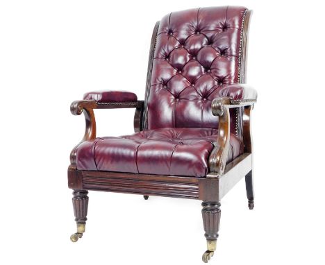 A 19thC mahogany framed library armchair, the button back seat and arms upholstered in red leather with inverted scroll arms 