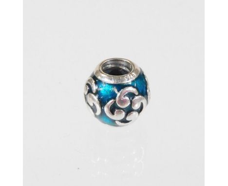 A Pandora charm, with blue enamel back, and floral central design, marked 925 ALE, 4.2g all in.  