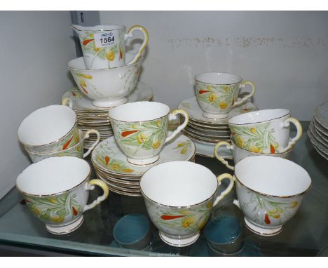 A Royal Stafford 'Crocus' part Teaset including nine cups and twelve saucers, etc., (some hairline cracks, one handle a/f).