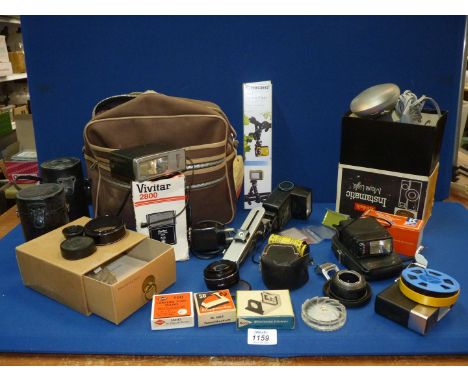 A Box of Photographic accessories, cases, Flash guns etc incl. a boxed Silver Crest mini camera Tripod.