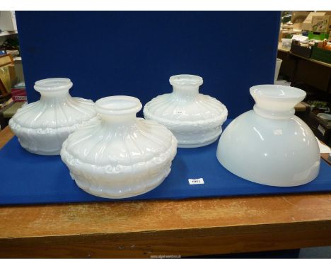 Four white glass oil lamp Shades.