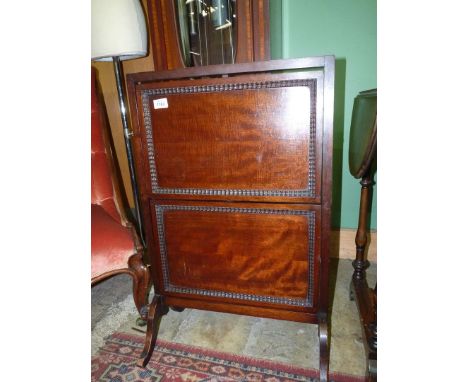A folding tea table, converts to a firescreen, 31" high overall x 20" wide.