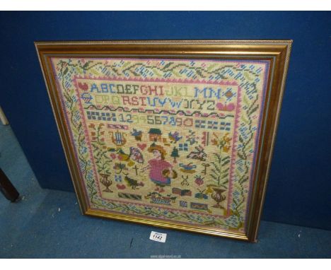 An attractive mid 20th century woolwork Sampler in a modern gilt frame, 17" square.
