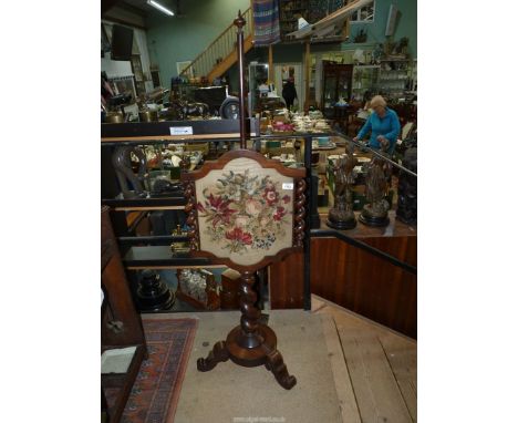 A Regency Pole Screen on spiral stem standing on three scroll feet, with matching sides, floral tapestry panel, 56" high over