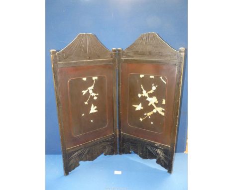 A two fold Firescreen with bone carved relief, birds and foliage, 28" wide (fully) x 30 1/2" high.