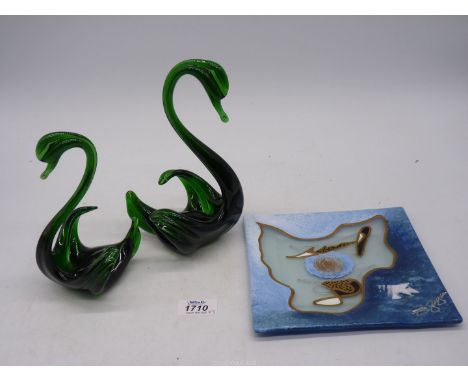 A pair of rare vintage glass swans, in thick green translucent glass of unusual shape, one being 8" tall and the other 6 3/4"