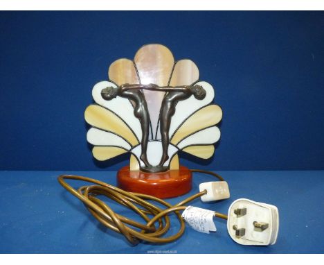 An Art Deco style table lamp featuring two female nudes with outstretched arms. 10 1/2" high.