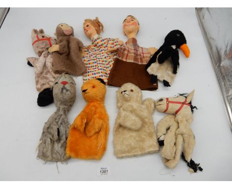 A 1950's 'Sooty' and 'Sweep' (ear missing) glove puppets by Chad Valley, together with soft toys including monkey, poodle, do