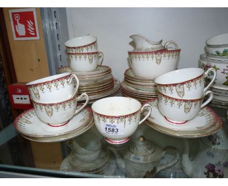 A Royal Doulton 'Tivoly' Teaset comprising two bread & butter plates, an oval plate,  twelve tea plates, eleven saucers, milk