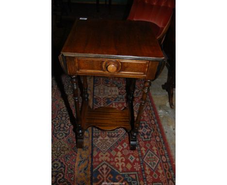 A Mahogany dropleaf occasional Table having a frieze drawer and standing on turned legs united by a lower shelf, 18" x 17" ex