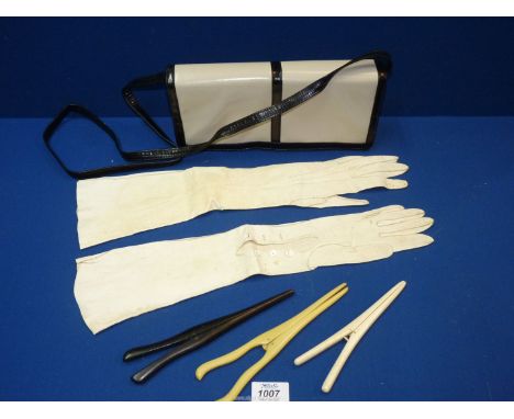 An Italian made handbag, vintage white leather gloves and glove stretchers.