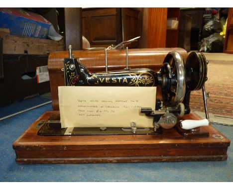 A Vesta hand sewing machine, c. 1920-1930, no.1626192, with some accessories, manual and key (handle on case a/f).