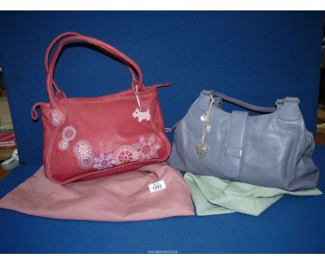 A Lavender leather Radley Handbag with tags, charms and dust bag.