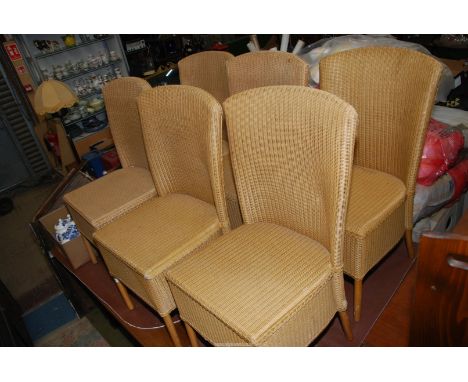 An appealing set of six British hand-made Lloyd Loom Dining Chairs finished in beige.