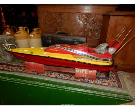 A model boat, 1mtr long x 300mm wide with a glow marine engine (not fitted).