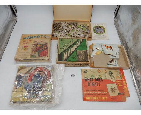 A box of vintage puzzles, some Mammoth, etc.