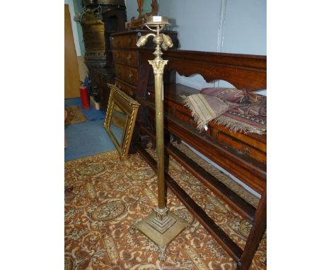 A Brass telescopic, Corinthian column standard Lamp with triple light fittings, standing on square base with claw feet, (as f