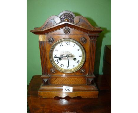 A bracket Clock with scrolling dome top, two train movement striking on a gong, pendulum (no key), 9 1/2" wide x 7" depth x 1