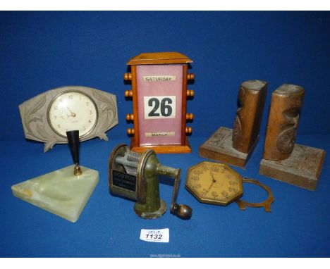 A small quantity of miscellanea including an Asprey eight day travel clock, small Westclox clock, perpetual desk calendar, pa