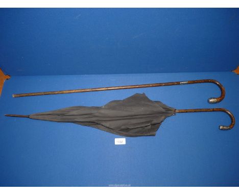 A bamboo walking stick with silver collar and tip, Birmingham possibly 1913, plus a mourning Parasol with silver tip to handl