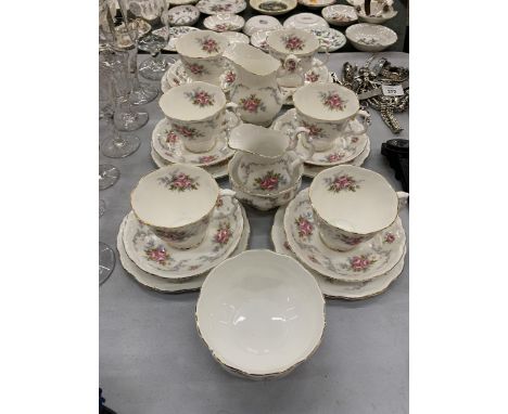 A ROYAL ALBERT 'TRANQUILITY' TEASET TO INCLUDE CUPS, SAUCERS, SIDE PLATES, TWO CREAM JUGS AND A SUGAR BOWL 