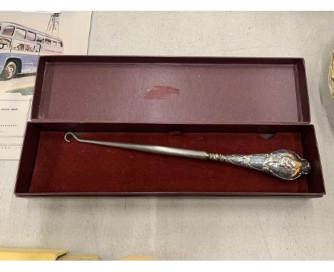 A VINTAGE SILVER HANDLED BUTTON HOOK 