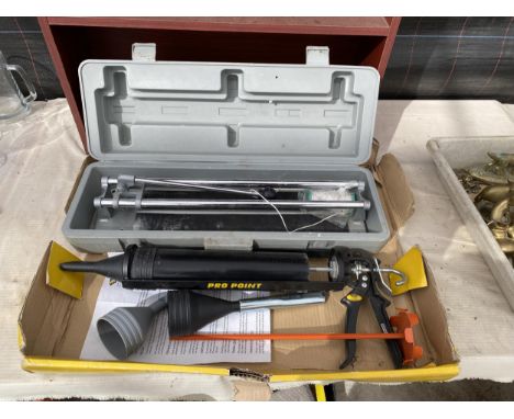 A PRO POINT GUN KIT AND A TILE CUTTER 