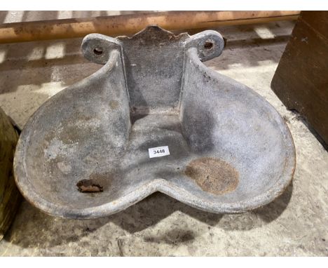 A VINTAGE LEADED CALF FEEDER 