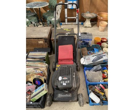 A MOUNTFIELD LAWN MOWER WITH BRIGGS AND STRATTON PETROL ENGINE 