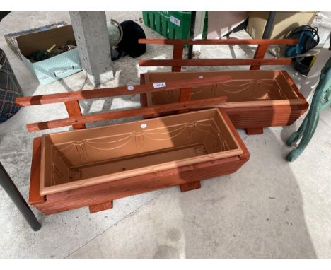 TWO WOODEN TROUGH PLANTERS WITH PLASTIC INSERTS AND TRELIS BACKS 