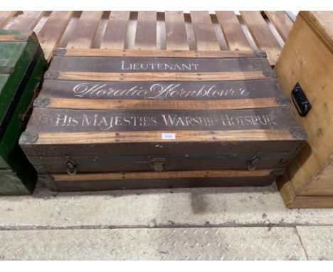 A VINTAGE MILITARY TRAVELLING TRUNK WITH WOODEN SUPPORTS, HOTSPUR 