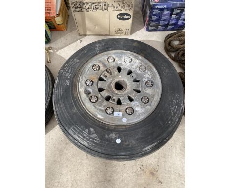 A VINTAGE BELIEVED WWII AREOPLANE WHEEL 