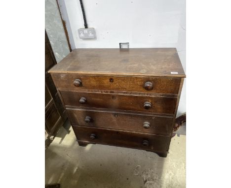 A VINTAGE OAK CHEST OF FOUR DRAWERS 