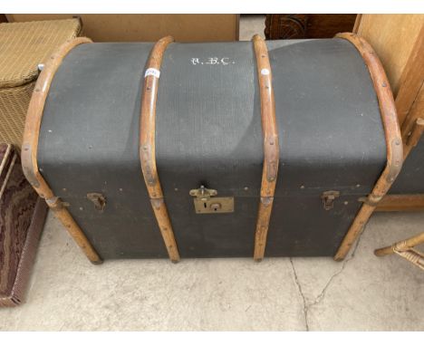 A VICTORIAN DOMED TOP TRAVELLNG TRUNK 