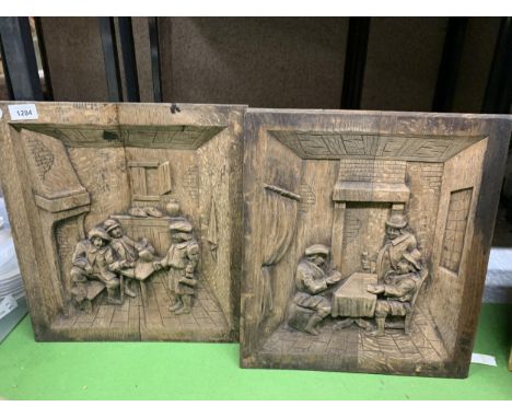 TWO OAK CARVED PANELS OF VINTAGE TAVERN SCENES 38CM X 42CM 