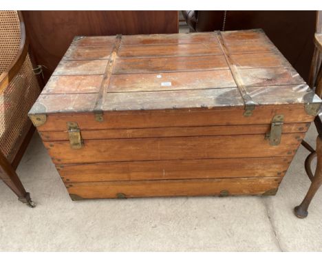 A VICTORIAN TRAVELLING TRUNK WITH BRASS CORNERS AND HASPS 39" X 26" X 23" HIGH 