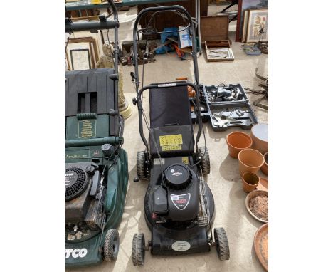 A PETROL LAWN MOWER WITH GRASS BOX AND BRIGGS AND STRATTON ENGINE 