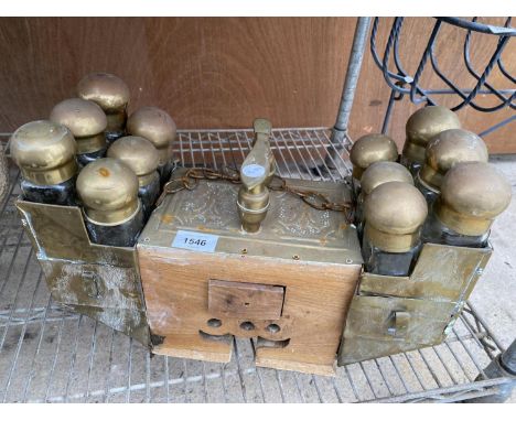 A VINTAGE INDIAN STYLE SPICE RACK COMPLETE WITH GLASS SPICE BOTTLES 