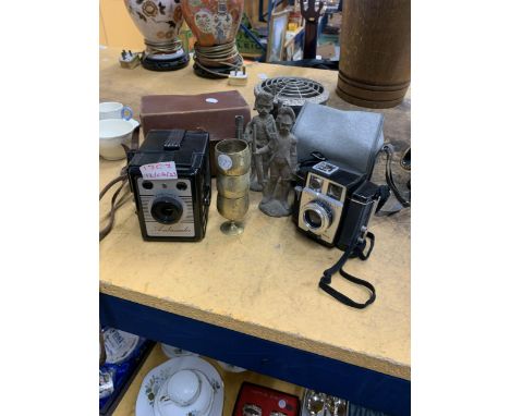 A VINTAGE BROWNIE "TWIN 20" CAMERA, A CORENETTE AND BASSADOR CAMERA, BOTH IN CASES, TWO HEAVY BRASS SOLDIER FIGURES, THREE SM